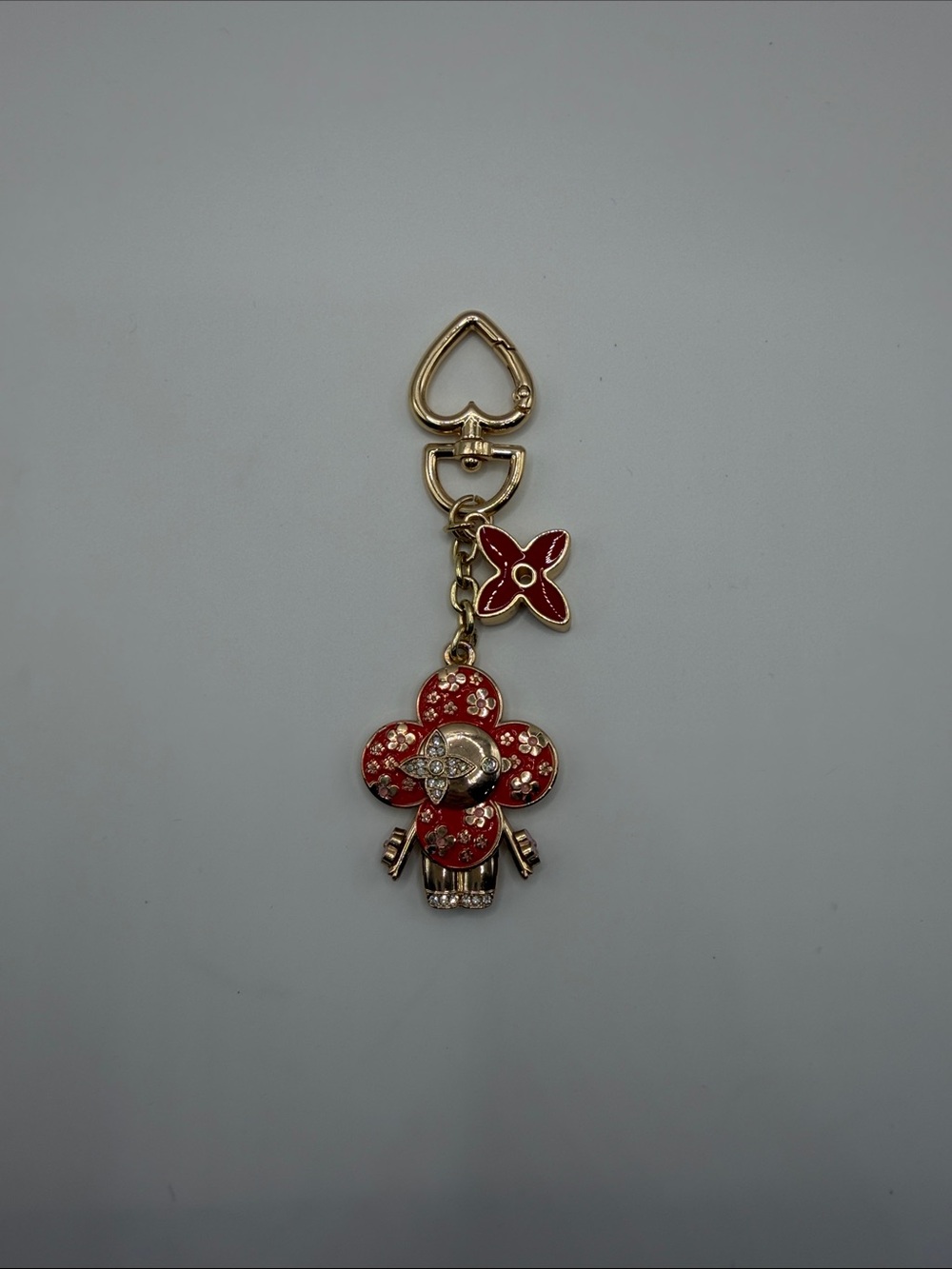 1410. Gold-Tone Red Vivi Charm Keychain or Bag Charm.